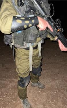 Soldier wearing custom protective arm guard